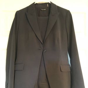 Tahari navy blue woman’s suit.